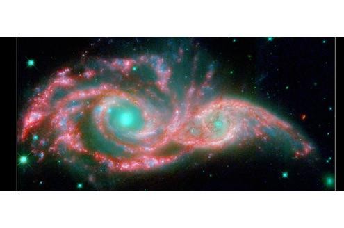 Zwei kleine Galaxien schieben sich ineinander und bilden eine neue, große Galaxie. Dieser Vorgang wird in etwa 140 Millionen Jahren beendet sein.
Bild: Nasa