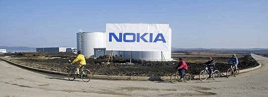 Children cycle past a billboard--543x199.jpg