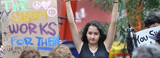 A young woman holds up--543x199.jpg